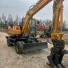 吕永响轮式挖机夹木机